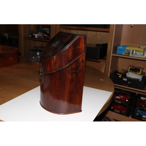 500 - A Georgian mahogany bowfronted knife box (lacks interior), 23cms wide.