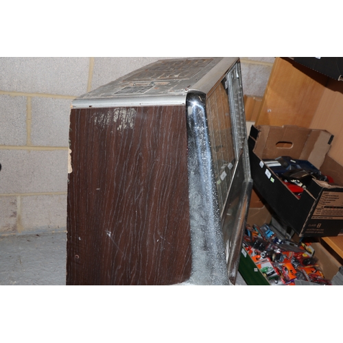 256 - A 1960's Rock-Ola Princess Juke Box, for restoration, 70cms wide; together with a selection 45rpm re... 