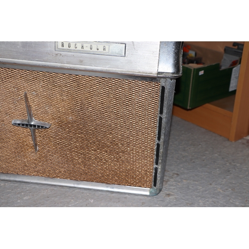 256 - A 1960's Rock-Ola Princess Juke Box, for restoration, 70cms wide; together with a selection 45rpm re... 