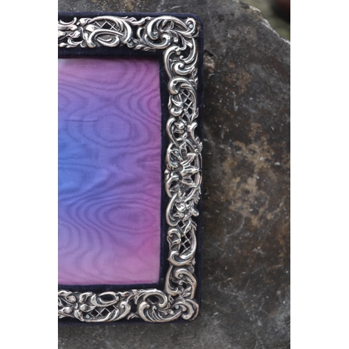 594 - An Edwardian silver strut photo frame, Birmingham 1905, overall 19.5 by 27cms.