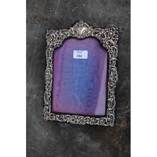 594 - An Edwardian silver strut photo frame, Birmingham 1905, overall 19.5 by 27cms.