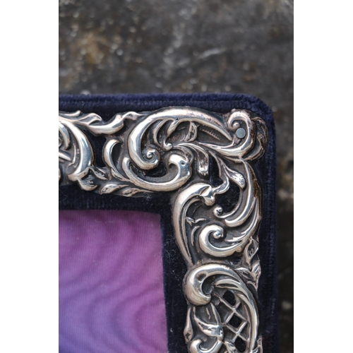 594 - An Edwardian silver strut photo frame, Birmingham 1905, overall 19.5 by 27cms.