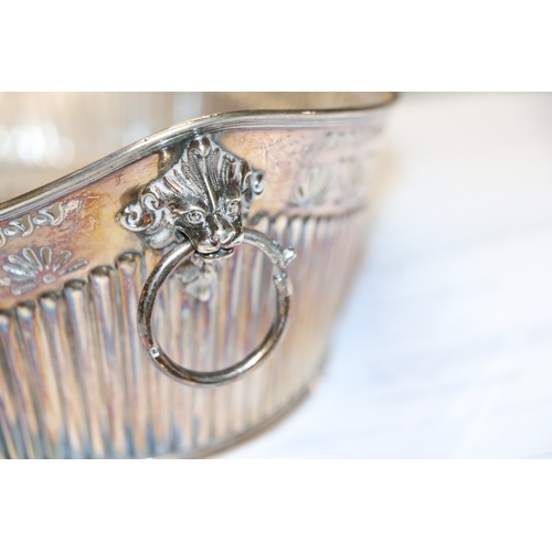 571 - A Victorian pierced silver bread basket with lion mask loop handles, Sheffield 1899 and maker's mark... 