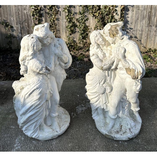 1 - A pair of reconstituted stone figural groups depicting courting couples, each approx 80cms high (2).