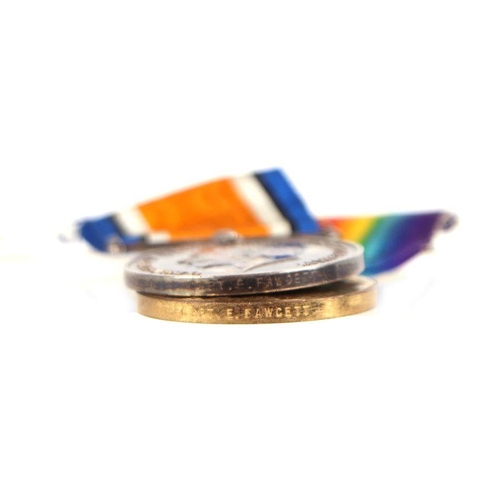 105 - A WWI medal pair named to 'Captain E. Fawcett; a WWII medal; a Newton College Challenge Cup medallio... 