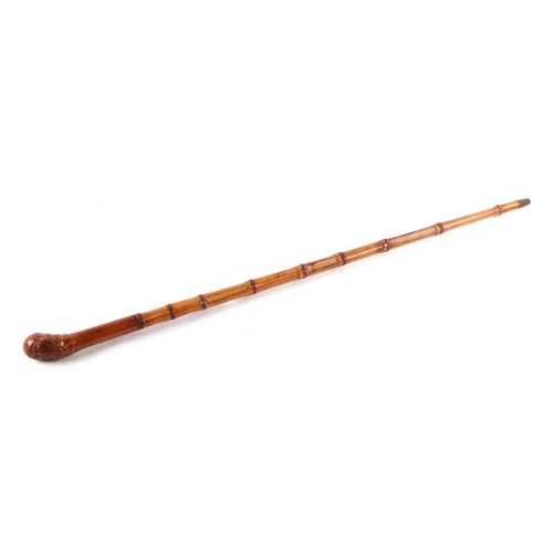 106 - A bamboo swordstick, overall 92cms long.