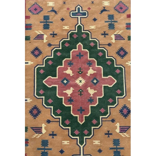 119 - An Indian dhurrie Kilim rug with central medallion on a camel ground with stylised birds and symbols... 