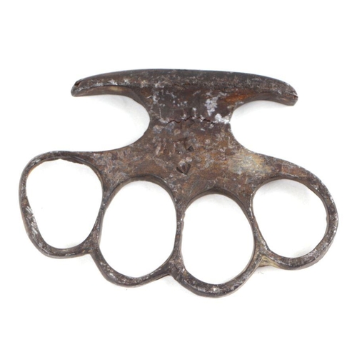 21 - A WWI Military knuckle duster with stamped Crow's Foot and numbered '517', 10cms wide.