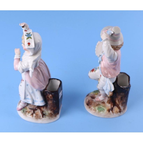 335 - A pair of continental porcelain figural spill vases, 21cms high (2).