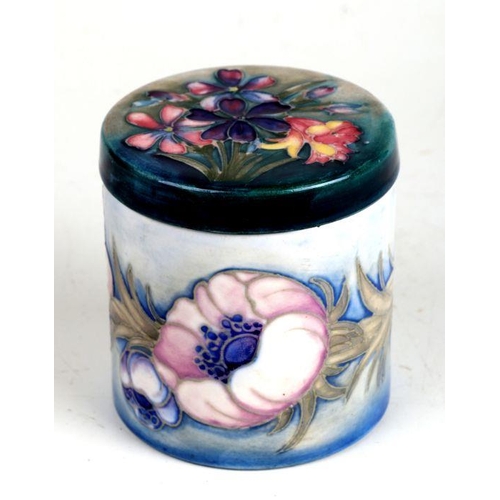 350 - A Moorcroft  pot and cover of cylindrical form decorated with poppies and spring flowers, impressed ... 