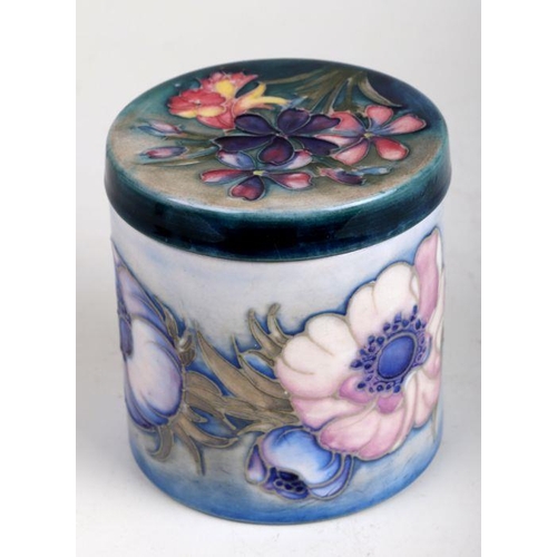 350 - A Moorcroft  pot and cover of cylindrical form decorated with poppies and spring flowers, impressed ... 