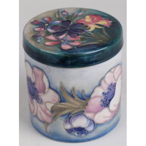 350 - A Moorcroft  pot and cover of cylindrical form decorated with poppies and spring flowers, impressed ... 