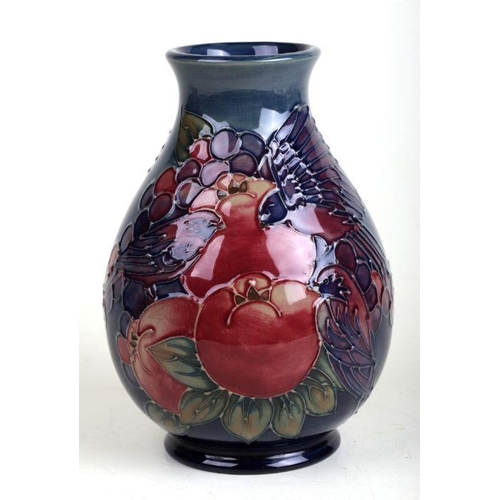 351 - A William Moorcroft Pomegranate, Grape & Birds pattern squat baluster form vase with tube lined deco... 