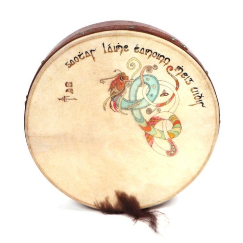 353 - An Irish Bodhran drum decorated with a Celtic design, 47cms diameter.