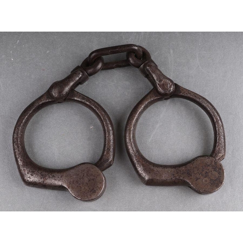 36 - A pair of steel handcuffs (lacks key).