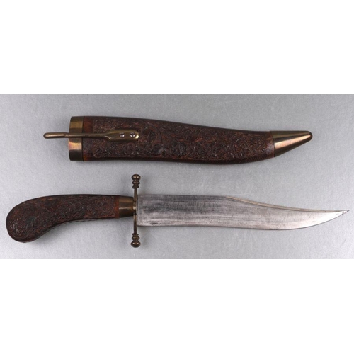 37 - An Indian dagger with carved hardwood scabbard and handle, 34cms long.