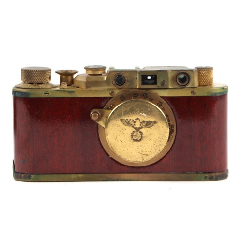 374 - A Leica M3 style brass camera in a leather case.