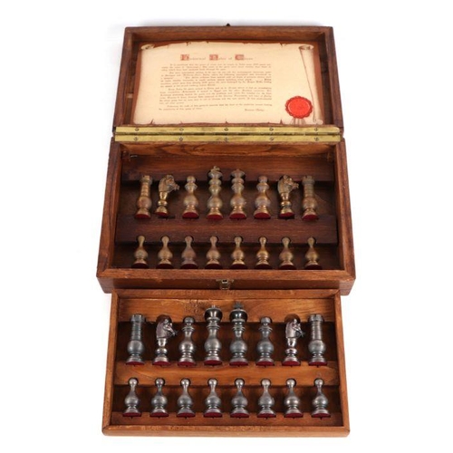 379 - A boxed pewter chess set.