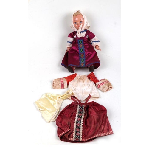 384 - A 1930's Russian folk doll in traditional clothing, 34cms high, boxed.Condition Report Good conditio... 