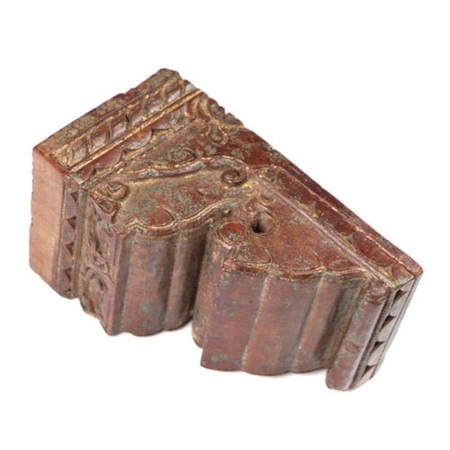 407 - An Indo-Persian  carved hardwood bracket with traces of original paint and gilt decoration, 24cms wi... 