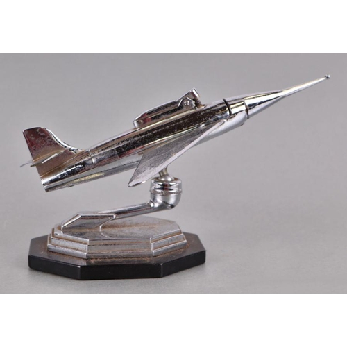 413 - A mid 20th century chrome plated table lighter in the form of a jet aeroplane on a stepped base, 34c... 