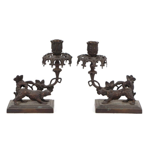 426 - A pair of Regency style bronze candlesticks, 19cms high (2).