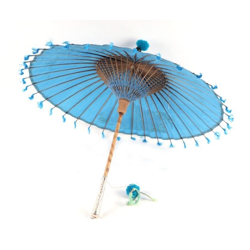 429 - A Chinese parasol with white metal handle and original tin carry case.