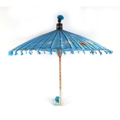 429 - A Chinese parasol with white metal handle and original tin carry case.