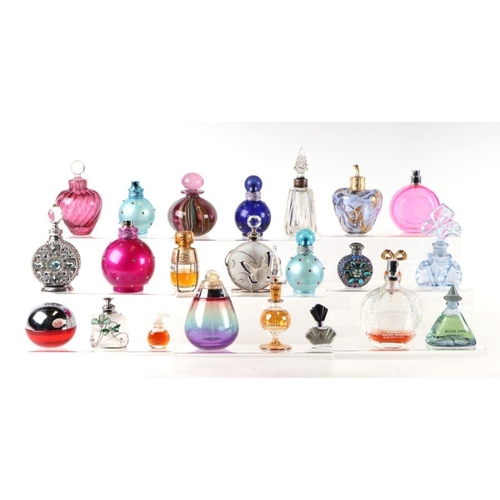 441 - A large collection of perfume and scent bottles.