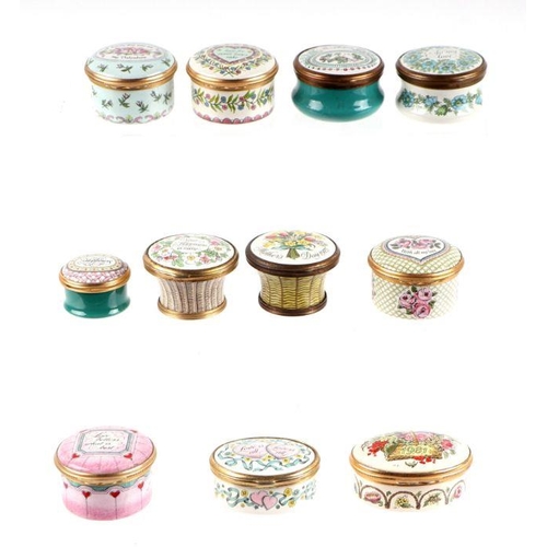 443 - A large collection of Halcyon Days enamel boxes to include Christmas boxes, egg shaped boxes and ann... 