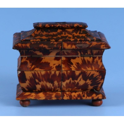 444 - A Regency tortoiseshell tea caddy with silver stringing, two-division department and bun feet, 17cms... 