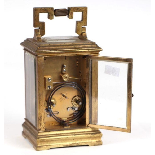 459 - A late 19th century French brass four-pillar carriage clock, the white dial with Roman and Arabic nu... 