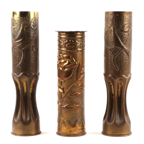 46 - A matching pair of WW1 trench art fluted brass shell cases decorated with doves and foliage. Overall... 