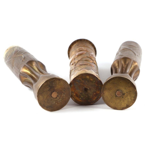 46 - A matching pair of WW1 trench art fluted brass shell cases decorated with doves and foliage. Overall... 