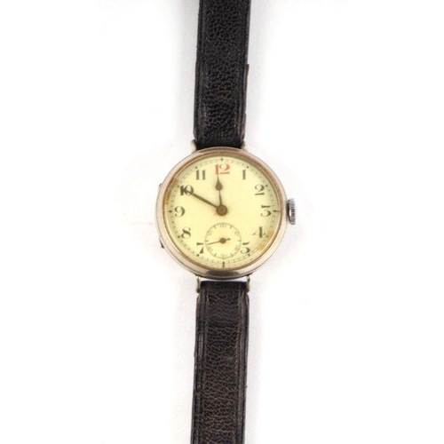 460 - A silver cased trench watch, the white dial with Arabic numerals and subsidiary seconds dial, the ba... 