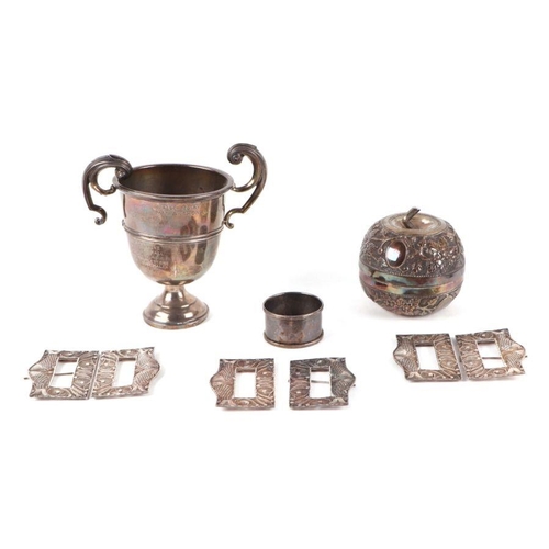 480 - A silver two-handled trophy cup; together with a silver napkin ring, 144g; a group of filigree white... 