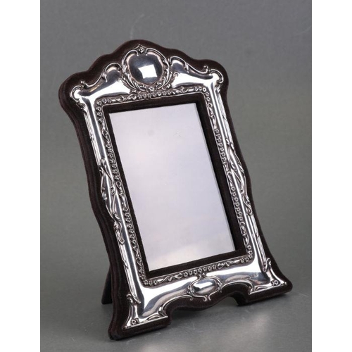 486 - A Victorian style silver strut photo frame, Birmingham 1983, overall 16 by 22cms.