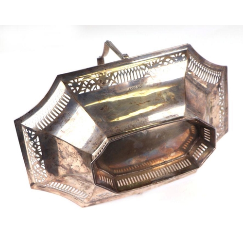 509 - A George III silver swing handled basket of shaped rectangular form with pierced border decoration, ... 