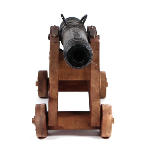 53 - A late 19th / early 20th century French Signal Cannon mounted on a wooden carriage. Having a cast ir... 