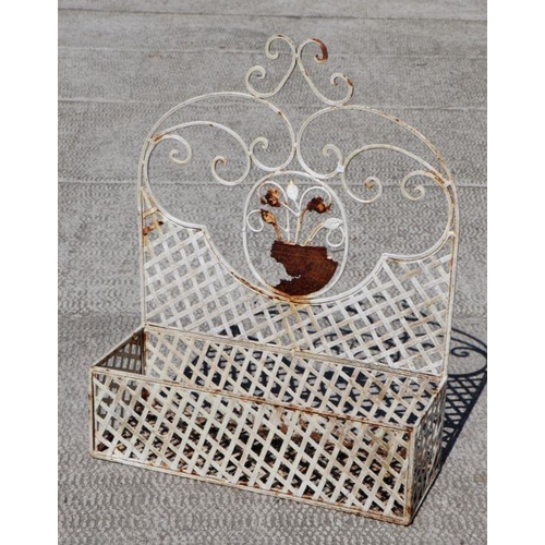 6 - A painted wrought iron wall mounted garden planter, 55cms wide.