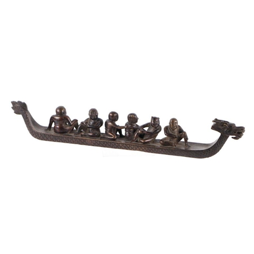 626 - A Chinese bronze dragon boat with six seated figures, seven character mark to the underside, 36cms l... 