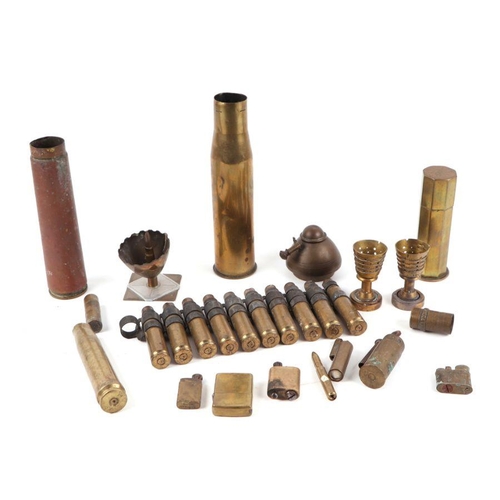 91 - An assortment of trench art, brass shell cases, lighters and inert munitions