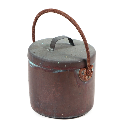 425 - A copper lidded pan with iron hoop handle.