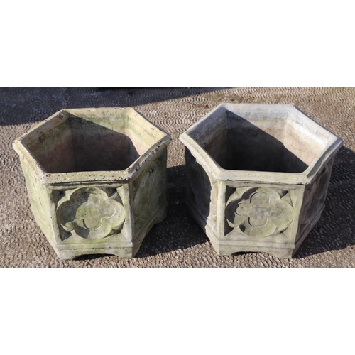 4 - A pair of rectangular reconstituted stone garden planters, 44cms diameter (2).