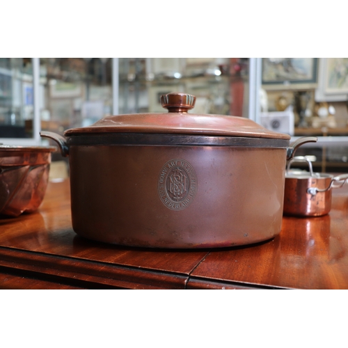 394 - A Victorian copper jelly mould, 23cms diameter; together with a copper pan and cover, 17cms wide; an... 