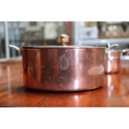 394 - A Victorian copper jelly mould, 23cms diameter; together with a copper pan and cover, 17cms wide; an... 