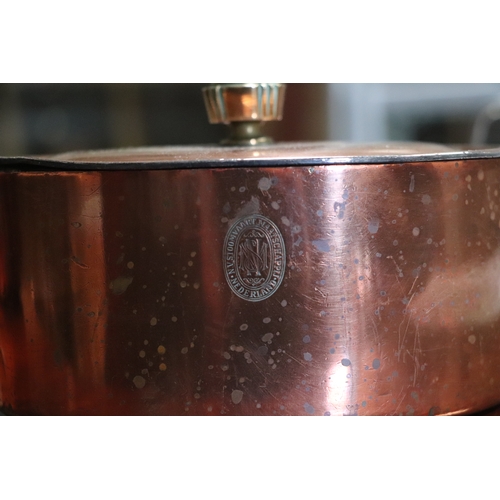 394 - A Victorian copper jelly mould, 23cms diameter; together with a copper pan and cover, 17cms wide; an... 