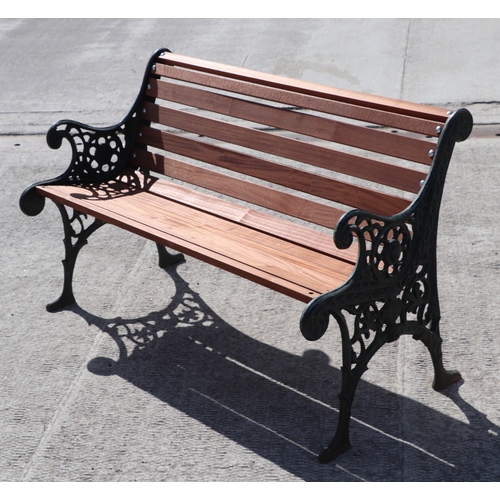 11A - A garden bench with teak slats and cast iron ends.119cm wide