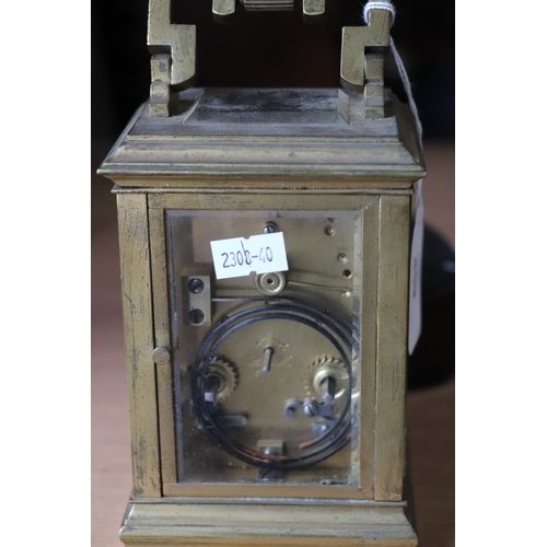 459 - A late 19th century French brass four-pillar carriage clock, the white dial with Roman and Arabic nu... 