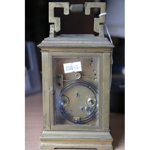 459 - A late 19th century French brass four-pillar carriage clock, the white dial with Roman and Arabic nu... 